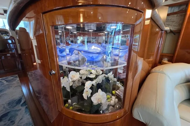 Slide: The Image of Luxurious interior of 2008 Neptunus Flybridge MY yacht with elegant floral display. - 100