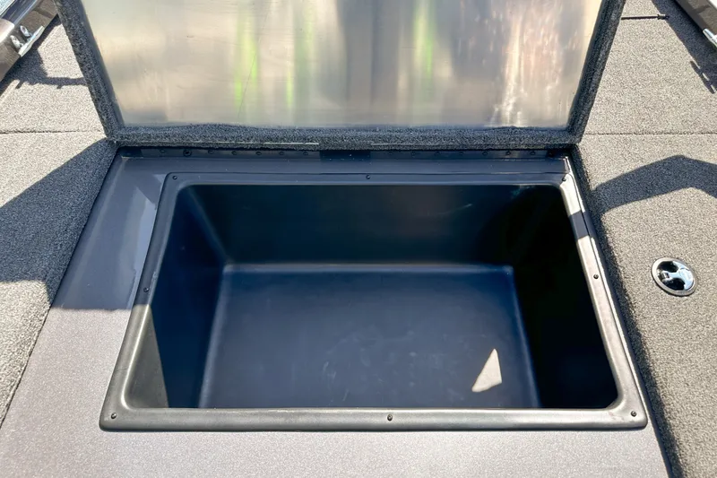 Slide: The Image of Open storage compartment on a 2019 Ranger RT178 boat, featuring a spacious interior. - 16