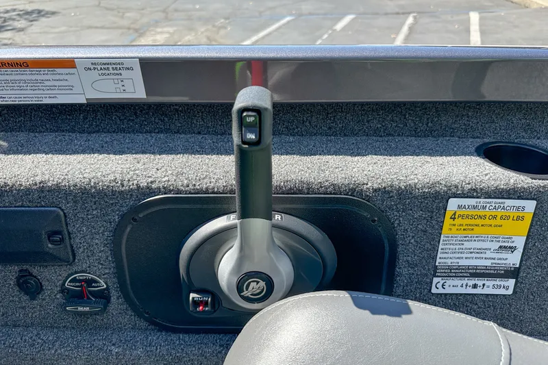 Slide: The Image of 2019 Ranger RT178 boat control panel with throttle and capacity warning labels. - 8