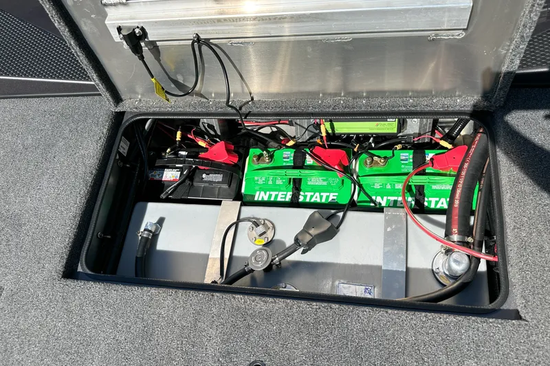 Slide: The Image of 2019 Ranger RT178 boat battery compartment with Interstate batteries and wiring. - 18