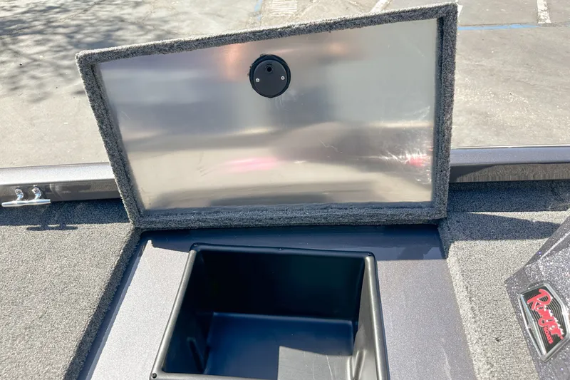Slide: The Image of 2019 Ranger RT178 boat storage compartment with open lid, showcasing interior space. - 17