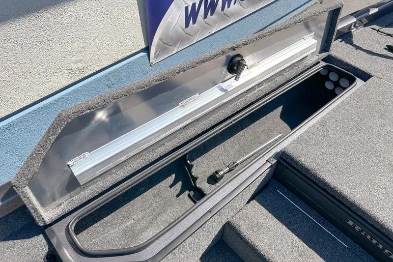 Slide: The Image of Open storage compartment in a 2019 Ranger RT178 boat, showcasing interior space. - 15