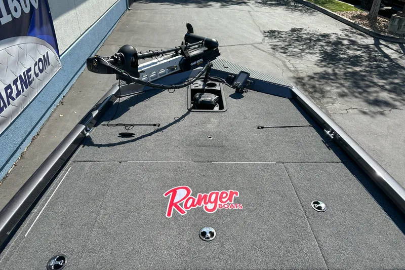 Slide: The Image of 2019 Ranger RT178 boat deck with trolling motor and electronics, parked outdoors. - 3