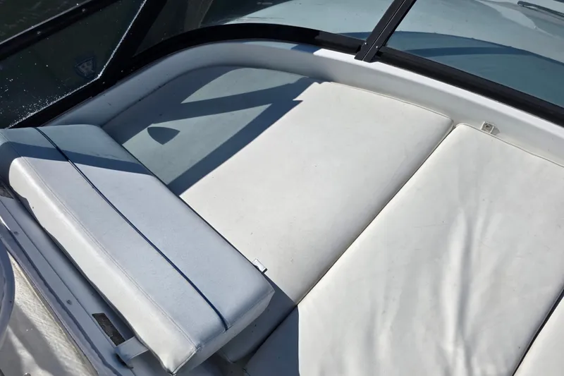 Slide: The Image of White cushioned seating on 2002 Neptunus 56 Flybridge yacht, under sunlight. - 15