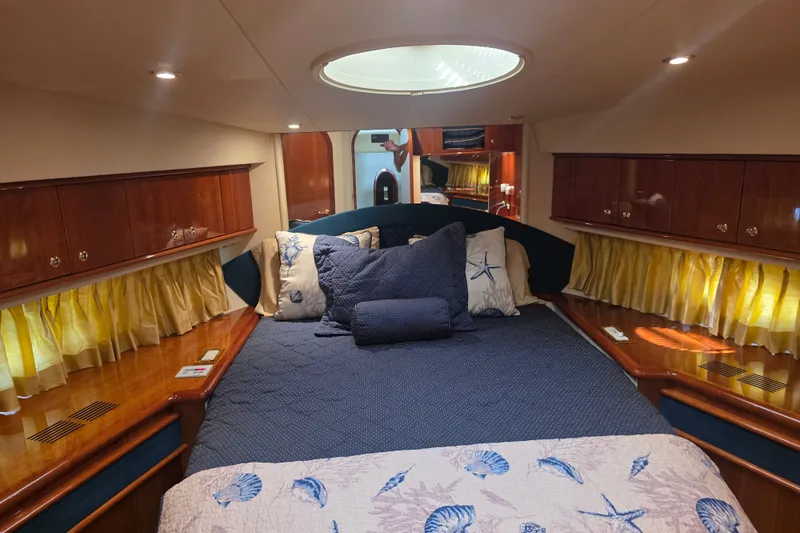Slide: The Image of Luxurious cabin interior of 2002 Neptunus 56 Flybridge yacht with elegant bedding. - 90