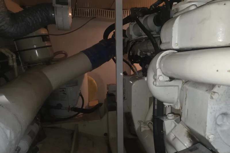 Slide: The Image of Engine room of a 2002 Neptunus 56 Flybridge yacht, showcasing mechanical components. - 34