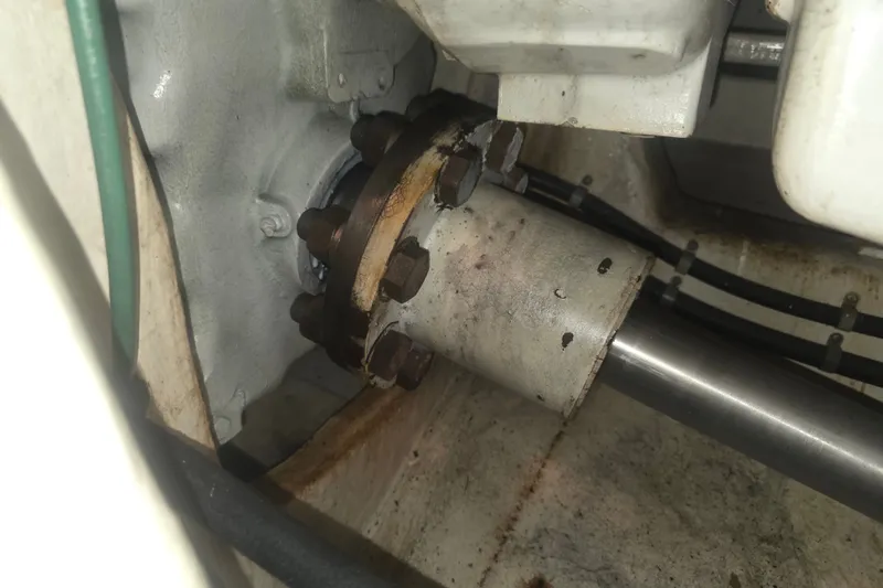 Slide: The Image of Engine component of a 2002 Neptunus 56 Flybridge yacht, showing shaft and bolts. - 39
