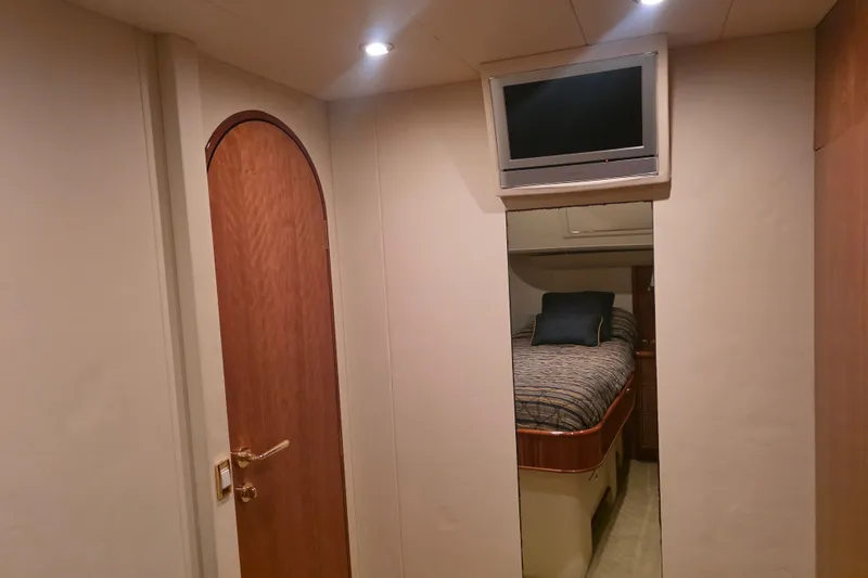 Slide: The Image of Interior of 2002 Neptunus 56 Flybridge yacht with cozy bedroom and wall-mounted TV. - 72