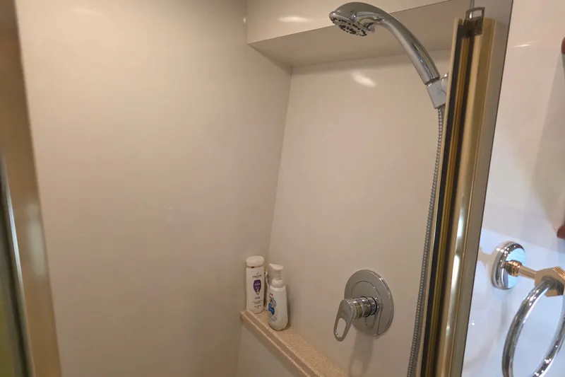 Slide: The Image of Shower area in 2002 Neptunus 56 Flybridge yacht with chrome fixtures and toiletries. - 69