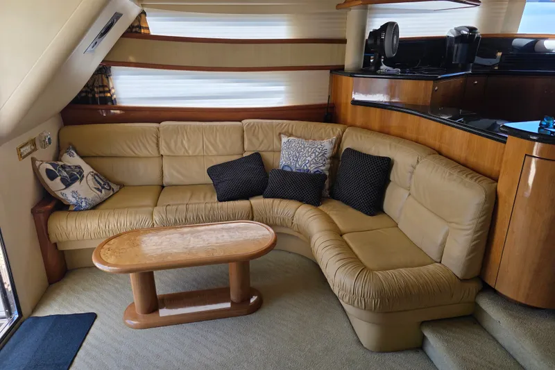 Slide: The Image of Luxurious interior of 2002 Neptunus 56 Flybridge yacht with leather seating and elegant decor. - 50