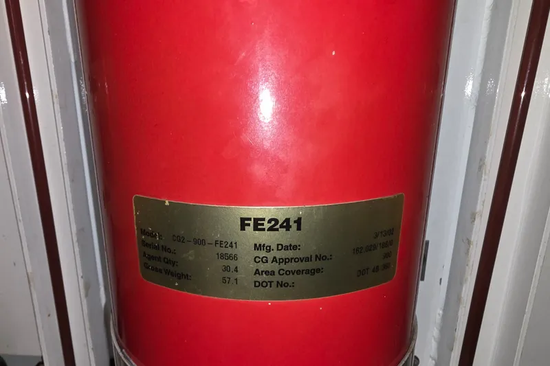 Slide: The Image of Red fire extinguisher labeled FE241 on a 2002 Neptunus 56 Flybridge yacht. - 27