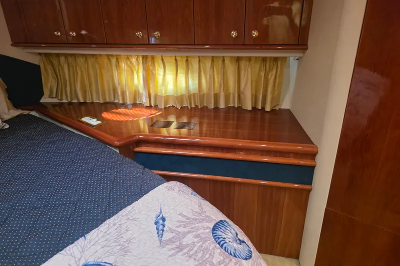 Slide: The Image of Luxurious cabin interior of 2002 Neptunus 56 Flybridge yacht with wood finish. - 89