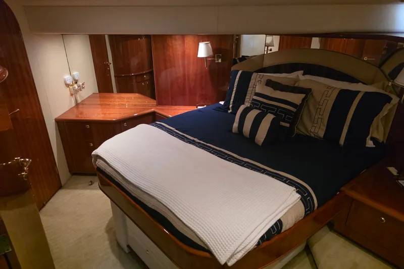 Slide: The Image of Luxurious bedroom interior of 2002 Neptunus 56 Flybridge yacht with elegant bedding. - 62