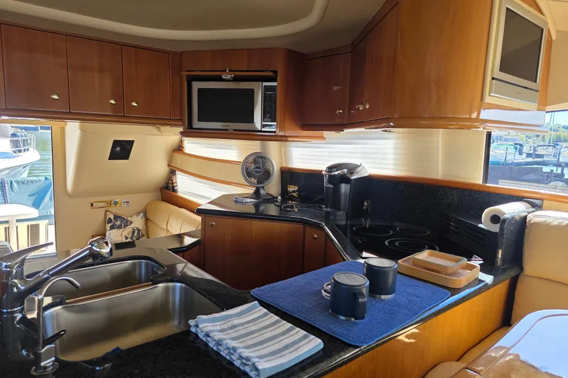 Slide: The Image of Luxurious kitchen interior of 2002 Neptunus 56 Flybridge yacht with modern amenities. - 55