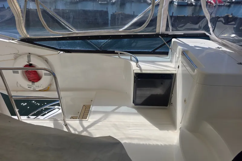 Slide: The Image of Flybridge of 2002 Neptunus 56 yacht with life preserver and storage compartments. - 7