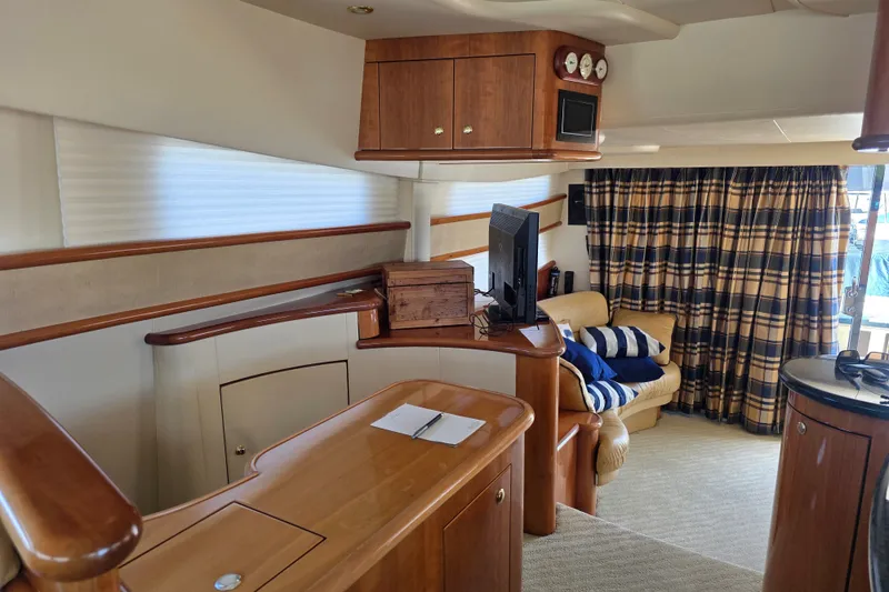 Slide: The Image of Luxurious interior of a 2002 Neptunus 56 Flybridge yacht with elegant wood finishes. - 53