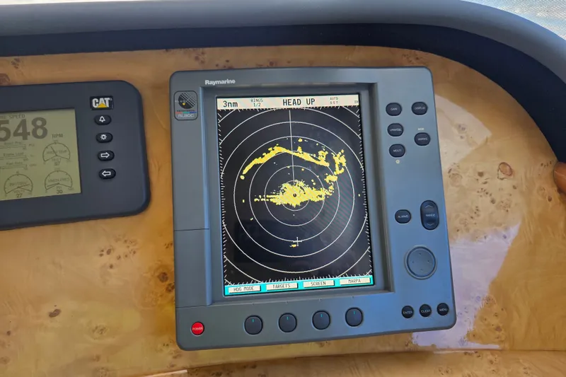 Slide: The Image of Radar display on 2002 Neptunus 56 Flybridge yacht, showing navigation data. - 60
