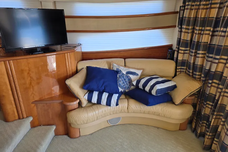 Slide: The Image of Luxurious Neptunus 56 Flybridge 2002 yacht interior with cozy sofa and decorative pillows. - 52