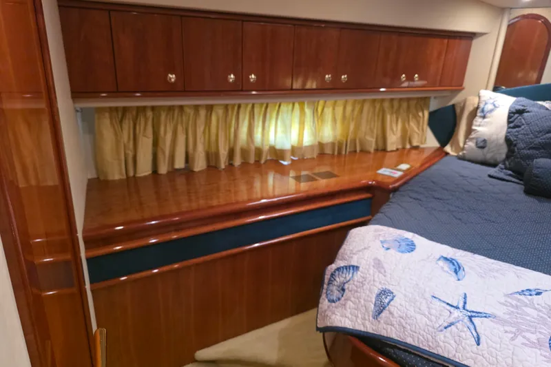 Slide: The Image of Luxurious cabin interior of 2002 Neptunus 56 Flybridge yacht with elegant wood finish. - 85