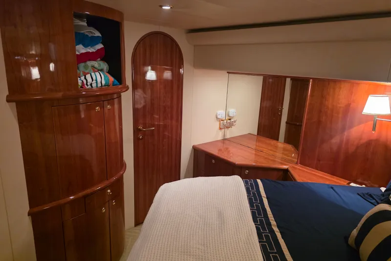 Slide: The Image of Luxurious cabin interior of 2002 Neptunus 56 Flybridge yacht with wood finishes. - 65
