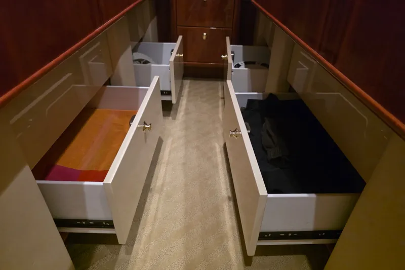 Slide: The Image of Open drawers in a 2002 Neptunus 56 Flybridge yacht interior, showcasing storage space. - 74