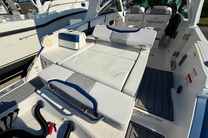 Slide: The Image of 2021 Chaparral 280 OSX boat interior with white seating and modern design. - 24
