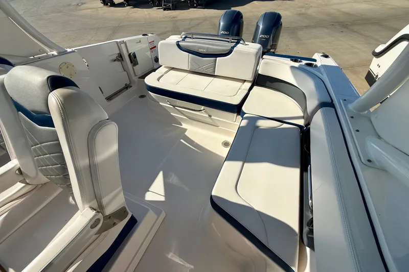 Slide: The Image of 2021 Chaparral 280 OSX boat interior with seating and dual engines. - 17