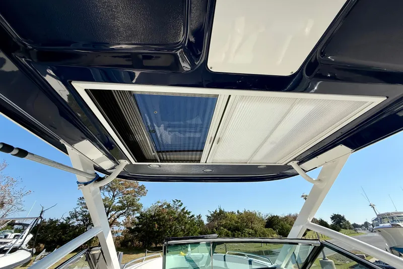 Slide: The Image of 2021 Chaparral 280 OSX boat roof with sunroof and support structure. - 23