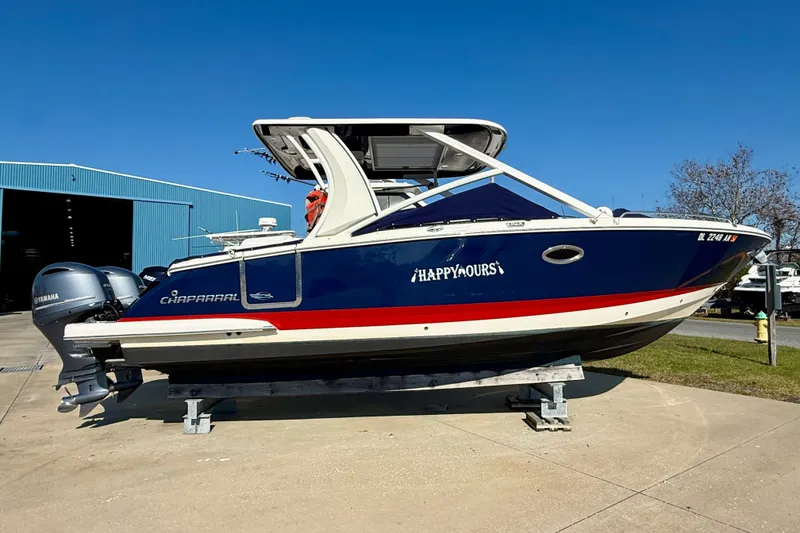 The Image of 2021 Chaparral 280 OSX boat on display, blue hull, dual Yamaha engines. - 0