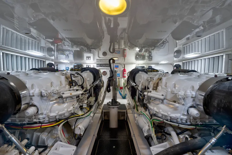 Slide: The Image of Engine room of a 2014 Viking 70C yacht, featuring dual powerful engines. - 72