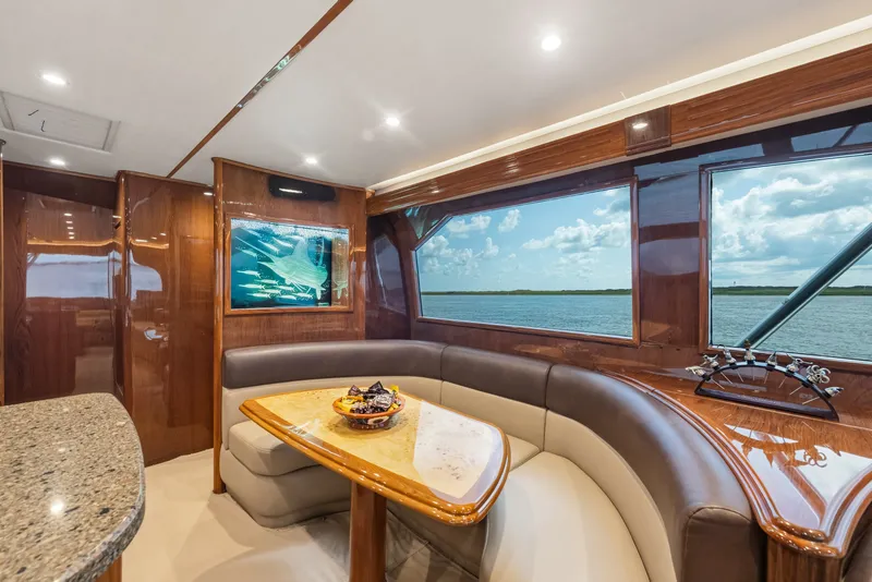 Slide: The Image of Luxurious interior of 2014 Viking 70C yacht with elegant seating and ocean view. - 61