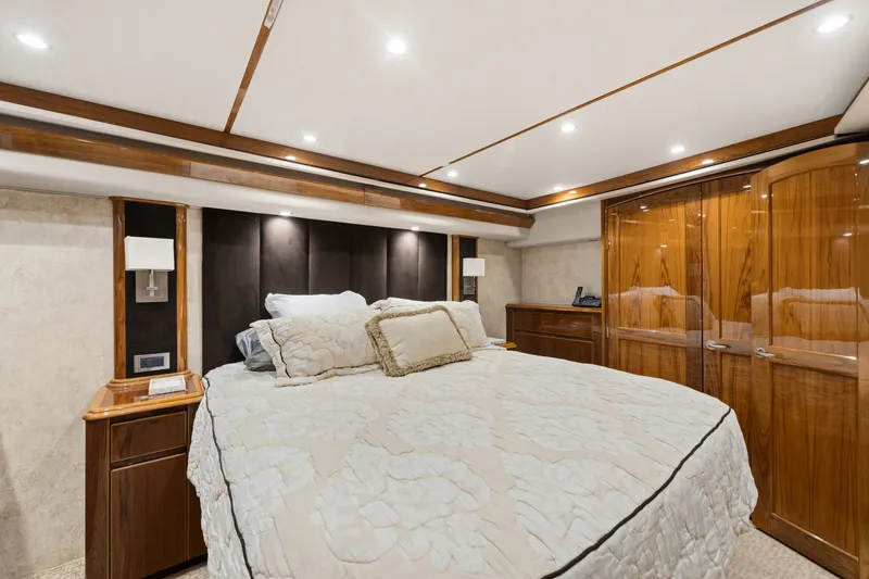 Slide: The Image of Luxurious bedroom interior of 2014 Viking 70C yacht with elegant wood finishes. - 54