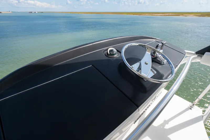 Slide: The Image of Steering console of a 2014 Viking 70C yacht overlooking serene waters. - 42