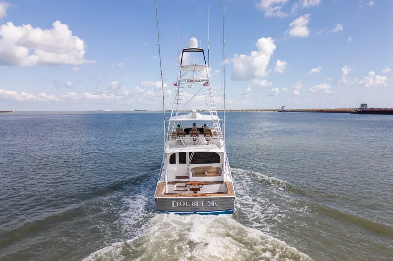 Slide: The Image of 2014 Viking 70C yacht cruising on open water under a clear blue sky. - 8