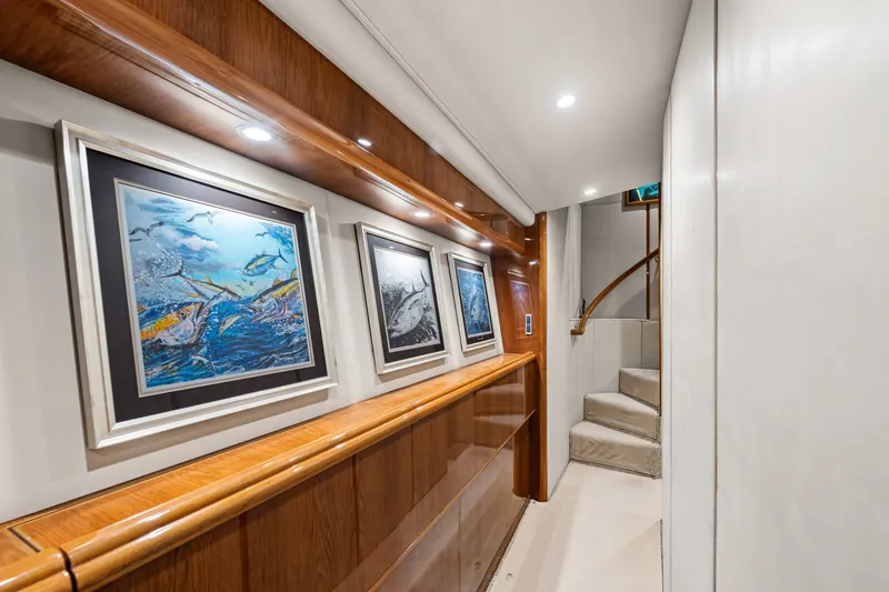 Slide: The Image of Luxurious hallway in 2014 Viking 70C yacht with framed marine artwork. - 58