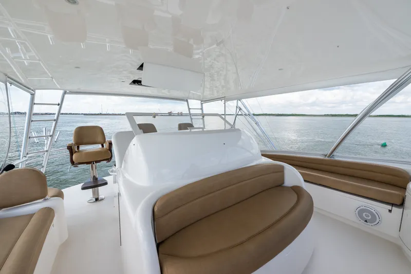Slide: The Image of Luxurious 2014 Viking 70C yacht interior with plush seating and ocean view. - 34