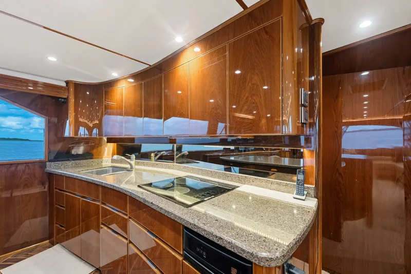 Slide: The Image of Luxurious kitchen interior of 2014 Viking 70C yacht with polished wood and modern appliances. - 67