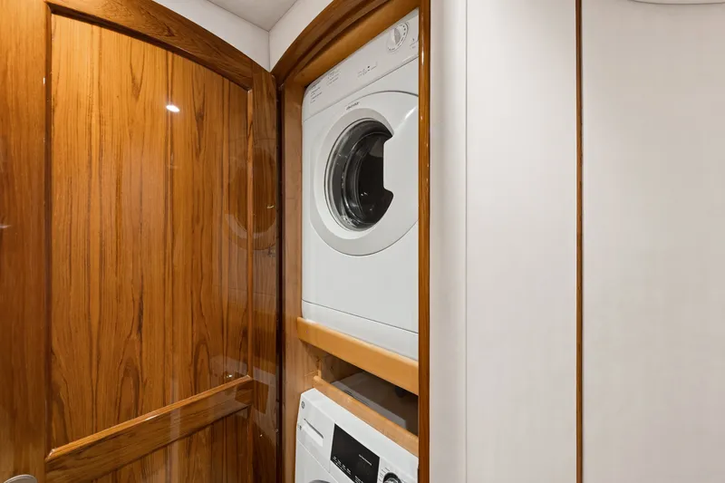 Slide: The Image of Stacked washer and dryer in 2014 Viking 70C yacht's wooden interior. - 50