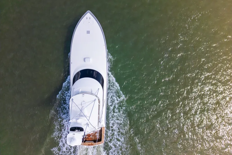 Slide: The Image of Aerial view of 2014 Viking 70C yacht cruising on open water. - 11