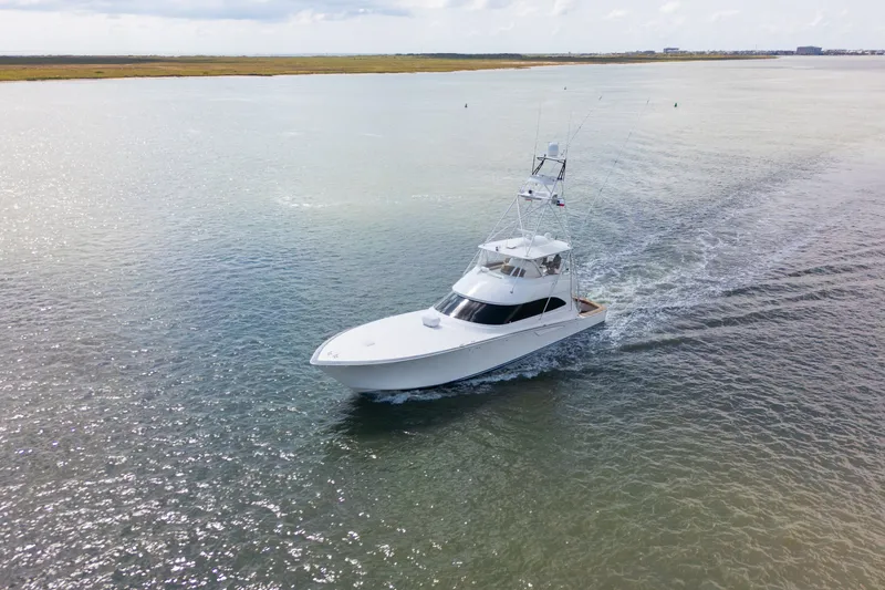 Slide: The Image of Aerial view of 2014 Viking 70C yacht cruising on open water. - 10