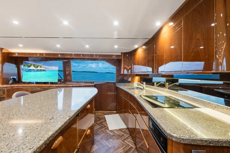 Slide: The Image of Luxurious interior of 2014 Viking 70C yacht with sleek wood finishes and ocean views. - 66