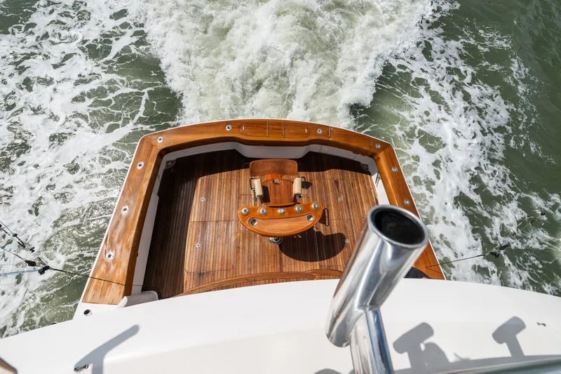 Slide: The Image of Aerial view of 2014 Viking 70C yacht's wooden deck and ocean wake. - 14