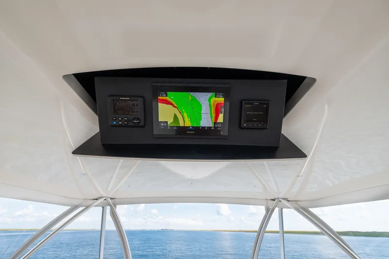 Slide: The Image of Control panel of a 2014 Viking 70C yacht with navigation displays. - 27