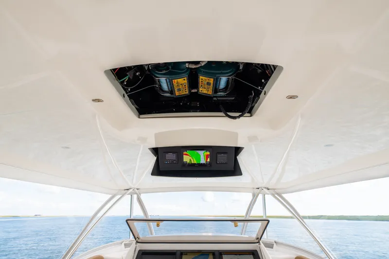 Slide: The Image of Interior view of 2014 Viking 70C yacht's helm with navigation equipment. - 28