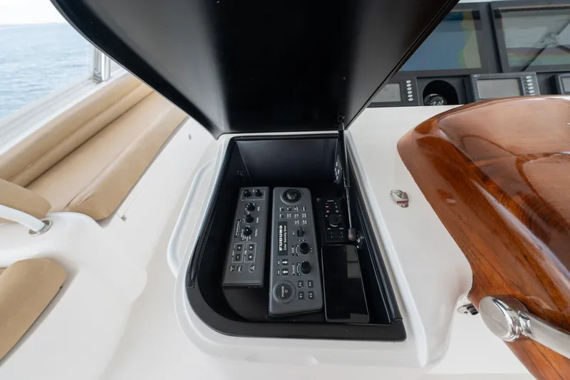 Slide: The Image of Control panel on a 2014 Viking 70C yacht, featuring navigation and communication equipment. - 31