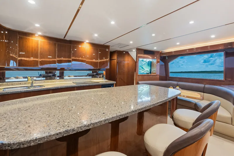 Slide: The Image of Luxurious interior of 2014 Viking 70C yacht with elegant wood finishes and ocean view. - 64