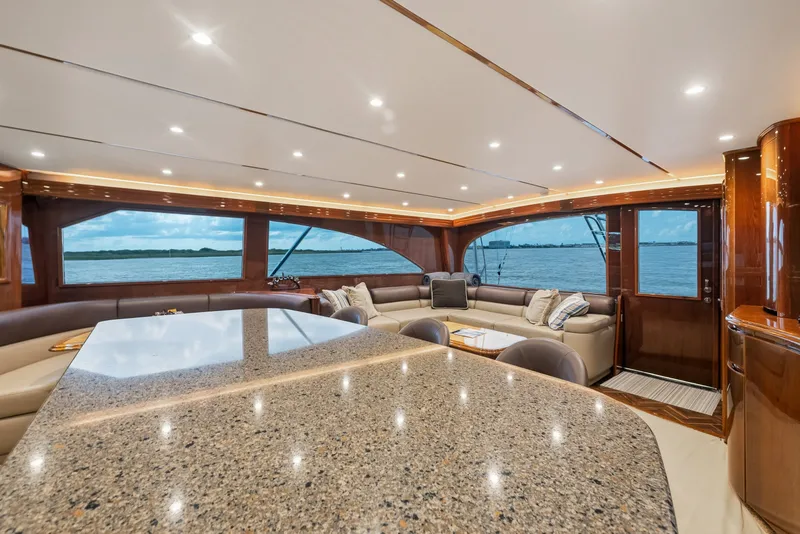 Slide: The Image of Luxurious interior of 2014 Viking 70C yacht with elegant seating and ocean view. - 68
