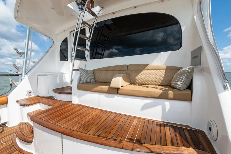 Slide: The Image of Luxurious 2014 Viking 70C yacht with elegant teak deck and comfortable seating area. - 20