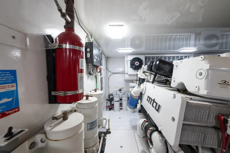 Slide: The Image of Engine room of 2014 Viking 70C yacht with MTU engine and fire extinguisher. - 81