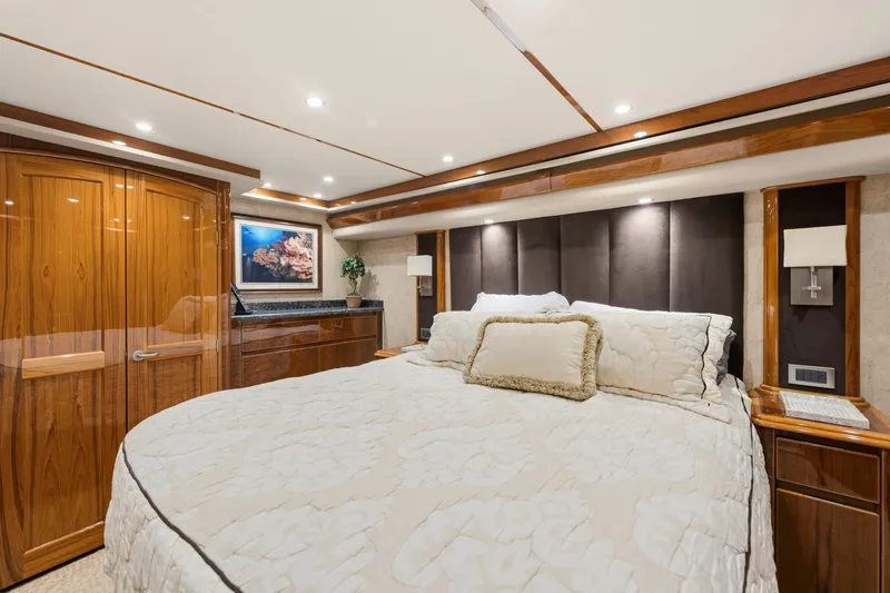 Slide: The Image of Luxurious bedroom interior of 2014 Viking 70C yacht with elegant wood finishes. - 56